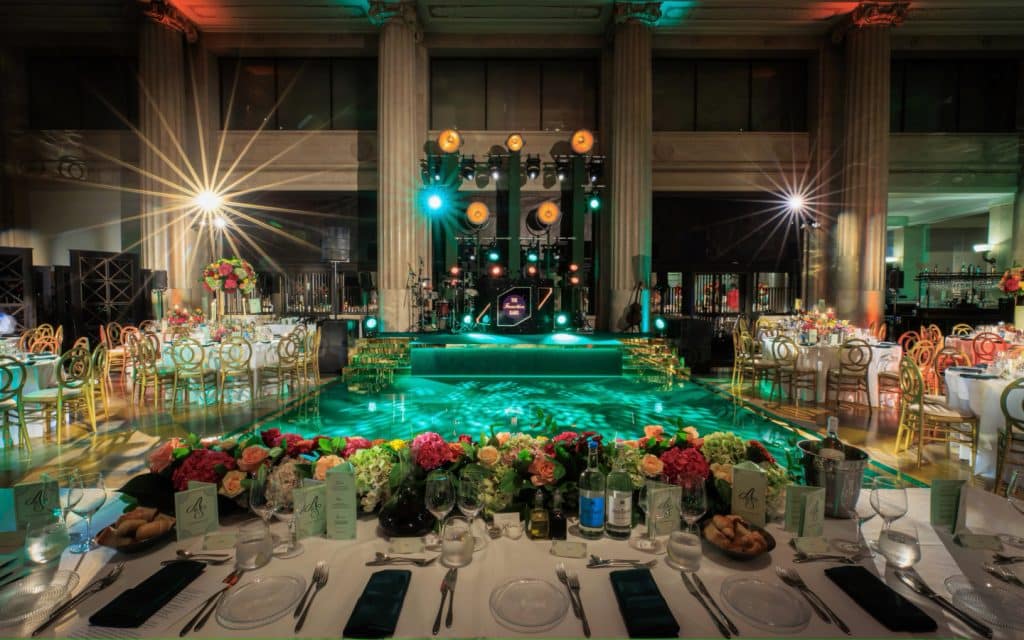 Wedding room with green lighting and flowers